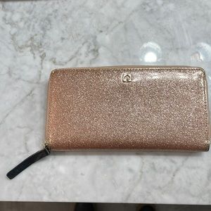 Kate Spade sparkle accordion zip around wallet in Rose Gold